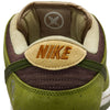 Close-up of the RAFFLE WINNER NIKE SB YUTO "MATCHA" Dunk Low Pro featuring iconic branding, crafted with premium materials for durability. The sneaker flaunts a textured design in asparagus, legion green, and light khaki with a tan inner lining.