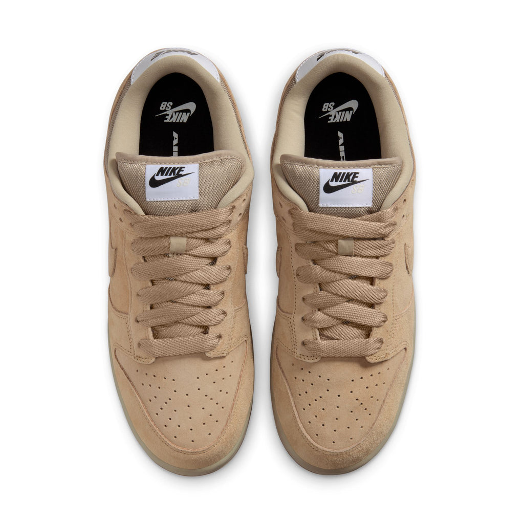 Top view of NIKE SB DUNK LOW PRO B PARACHUTE BEIGE sneakers showcases white logo tags on tongues, black insoles, and perforated toe areas; these nike shoes are designed with skate-specific upgrades for better performance and style.