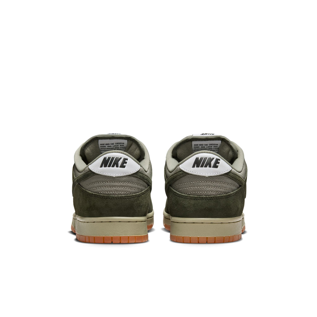 A pair of nike SB Dunk Low Pro B Sequoia/Sequoia-Light Army-White skate shoes seen from the back, with olive green uppers, white heel tabs featuring black Nike branding, and gum soles accented by Pale Ivory nubuck.
