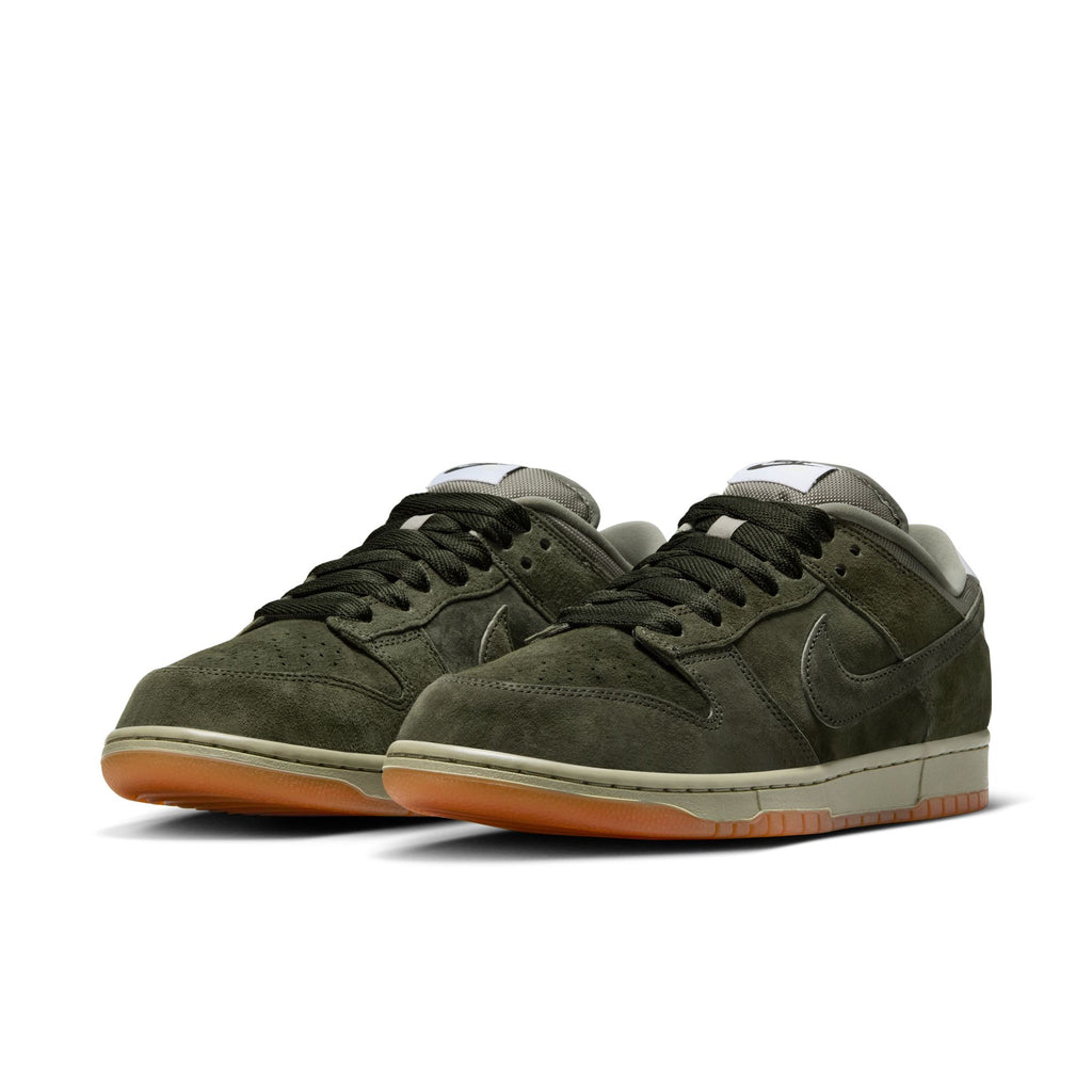 The NIKE SB DUNK LOW PRO B in Sequoia/Light Army features olive green suede uppers, black laces, white midsoles, and gum rubber outsoles.