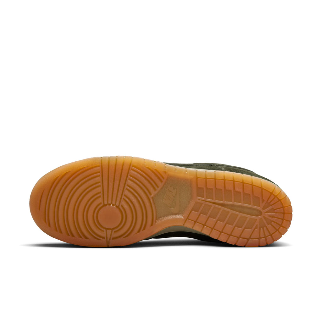 The image shows the sole of the NIKE SB DUNK LOW PRO B SEQUOIA/SEQUOIA-LIGHT ARMY-WHITE by nike, featuring a gum rubber outsole with circular and grid-like tread patterns.