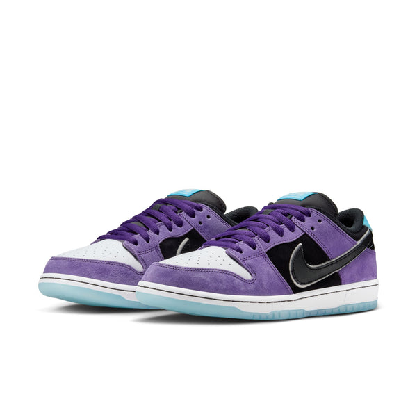 The NIKE SB Hayley Wilson Dunk Low Pro in Court Purple/Black-White-Lagoon Pulse features purple suede overlays, black swooshes, white toes, light blue outsoles, and premium materials for lightweight cushioning and all-day comfort.