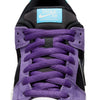 Close-up of the nike SB Hayley Wilson Dunk Low Pro in Court Purple/Black-White-Lagoon Pulse, featuring purple laces, a black tongue, blue logo label, and premium materials for comfort and style.