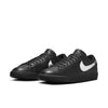 The NIKE SB ZOOM BLAZER LOW X DANCER BLACK/METALLIC SILVER-BLACK features a sleek design with premium leather and metallic silver swoosh logos, depicted from both front and side angles. Ideal for skateboarding enthusiasts who prioritize style and sturdiness.