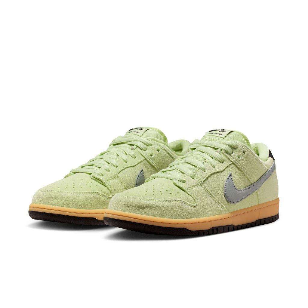 The NIKE SB DUNK LOW PRO VERDUGO MOUNTAIN by nike features a light green upper, gray swooshes, gum soles, and black outsoles, inspired by mountain biking trails near the Verdugo Mountains, shown against a white background.