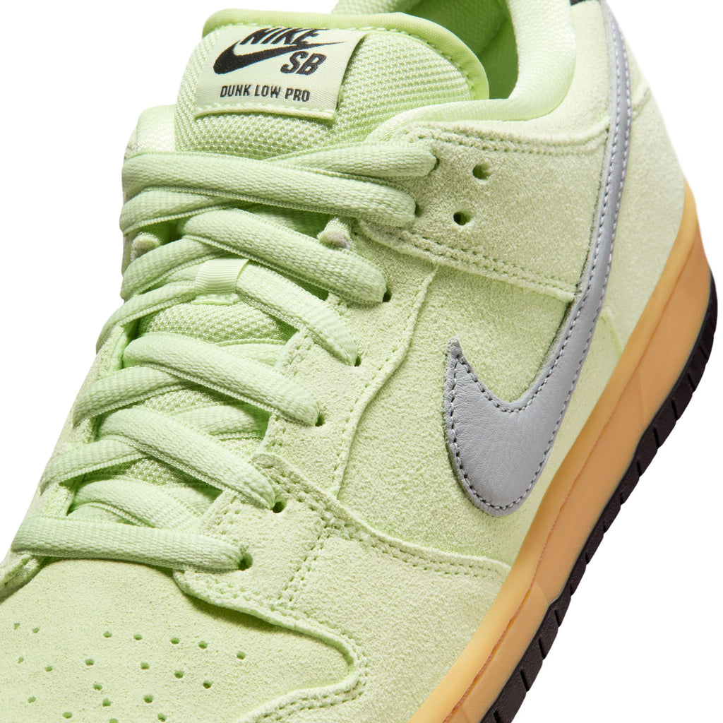 Close-up of the NIKE SB DUNK LOW PRO VERDUGO MOUNTAIN by nike, featuring light green suede, grey swoosh, gum sole, detailed laces and tongue label—designed for mountain biking, style, and daily wear.