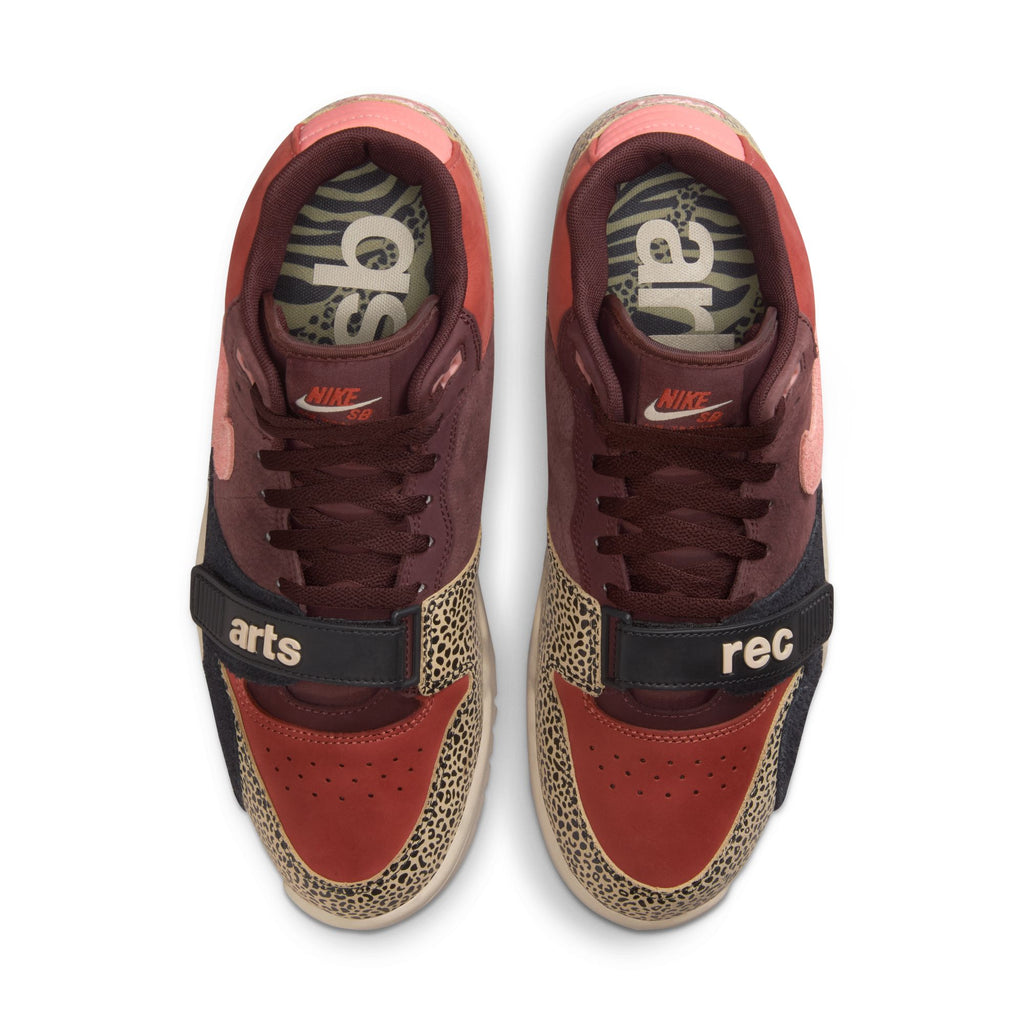 The nike NIKE SB x Arts-Rec Air Trainer 1 features Limestone, Pink Quartz, Earth, Dusty Peach, Black, and Desert Sand panels with "arts" on the left strap, "rec" on the right strap, and patterned insoles.