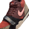 Close-up of the NIKE SB X ARTS-REC AIR TRAINER 1 in Limestone/Pink Quartz/Earth/Dusty Peach/Black/Desert Sand, featuring a pink Swoosh, animal print accents, and a black strap with "rec" text.