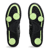 Image of the soles of a pair of ASICS GEL-SPLYTE BLACK / GRAPHITE GREY sports shoes. The soles are black with green circular patterns and various traction designs, showcasing the advanced FF BLAST cushioning for superior comfort.