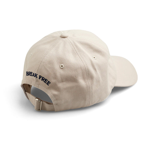 A beige LAST RESORT ATLAS LOGO DADDY CAP BEIGE hat with the word 'true' embroidered on it. (Brand Name: Last Resort AB)