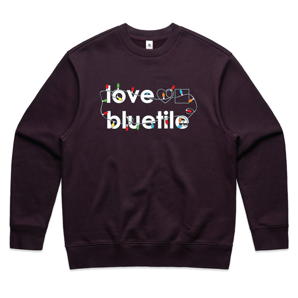 A BLUETILE "UGLY SWEATER" CREWNECK SUGAR PLUM with the word love on the front. (Brand Name: Bluetile Skateboards)
