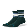 The STANCE SOCKS BOYD QUARTER PINE LARGE are dark green combed cotton socks with white and light blue stripes near the top and a small circular logo on the side.