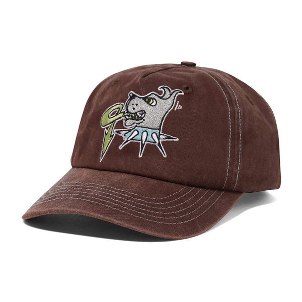 The BUTTER CANINE 5 PANEL CAP WASHED BROWN by Butter Goods is a cotton twill cap with embroidered gray dog and green lightning bolt artwork on the front, plus an adjustable snapback closure for comfort.