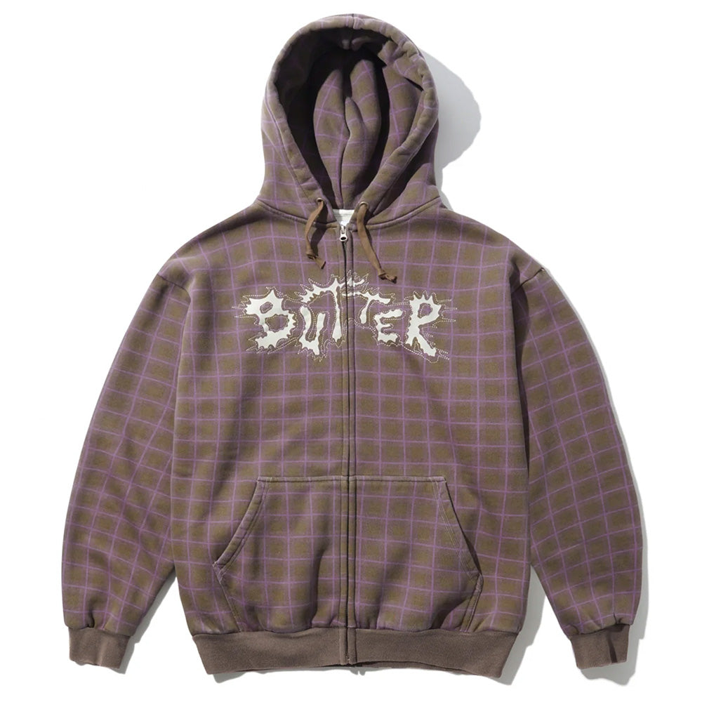 The Butter Goods BUTTER ERUPTION ZIP-THRU HOODIE PLAID features a brown and purple plaid design with mineral wash finish, zip-up front, hood, and front pockets. "BITTER" is printed on the chest in a jagged white font.