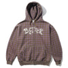 The Butter Goods BUTTER ERUPTION ZIP-THRU HOODIE PLAID features a brown and purple plaid design with mineral wash finish, zip-up front, hood, and front pockets. "BITTER" is printed on the chest in a jagged white font.