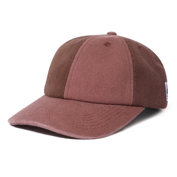 A BUTTER GOODS PATCHWORK 6 PANEL HAT WASHED BURGUNDY baseball cap with a self fabric strap on a white background.