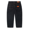 A pair of BUTTER GOODS SANTOSUOSSO DENIM PANT WASHED BLACK jeans with an orange patch on the back and a baggy fit.