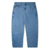 A pair of Butter Goods Santosuosso Denim Pant Washed Indigo jeans with buttons on the side and green stitching.