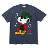 The Butter Goods x Peanuts Music Tee Slate is a navy 100% cotton T-shirt with Snoopy in sunglasses, green bandana, red jacket, yellow boots, music notes, and “BUTTER” & “ALL I CARE ABOUT IS MY MUSIC!” on the front—a classic Butter Goods piece.