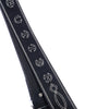 A close-up of the BUTTER BRONCO BELT BLACK by Butter Goods, a black leather belt featuring contrast stitching and white stitched designs, including a treble clef and other unique symbols.