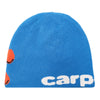 Carpet Co.'s BACTERIA REVERSIBLE BEANIE BLUE features the word "carp" in white text, partially visible orange fish graphics on the left side, and the stylish BRAT LOGO.