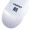 Close-up of a skateboard deck from Carpet Co. featuring the words "CARPET BACTERIA" and a stylized number 18 logo screen-printed on it, showcasing its vibrant base colors.