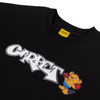 A close up of a black t-shirt with white font that says "Carpet" next to a little bear with boxing gloves.