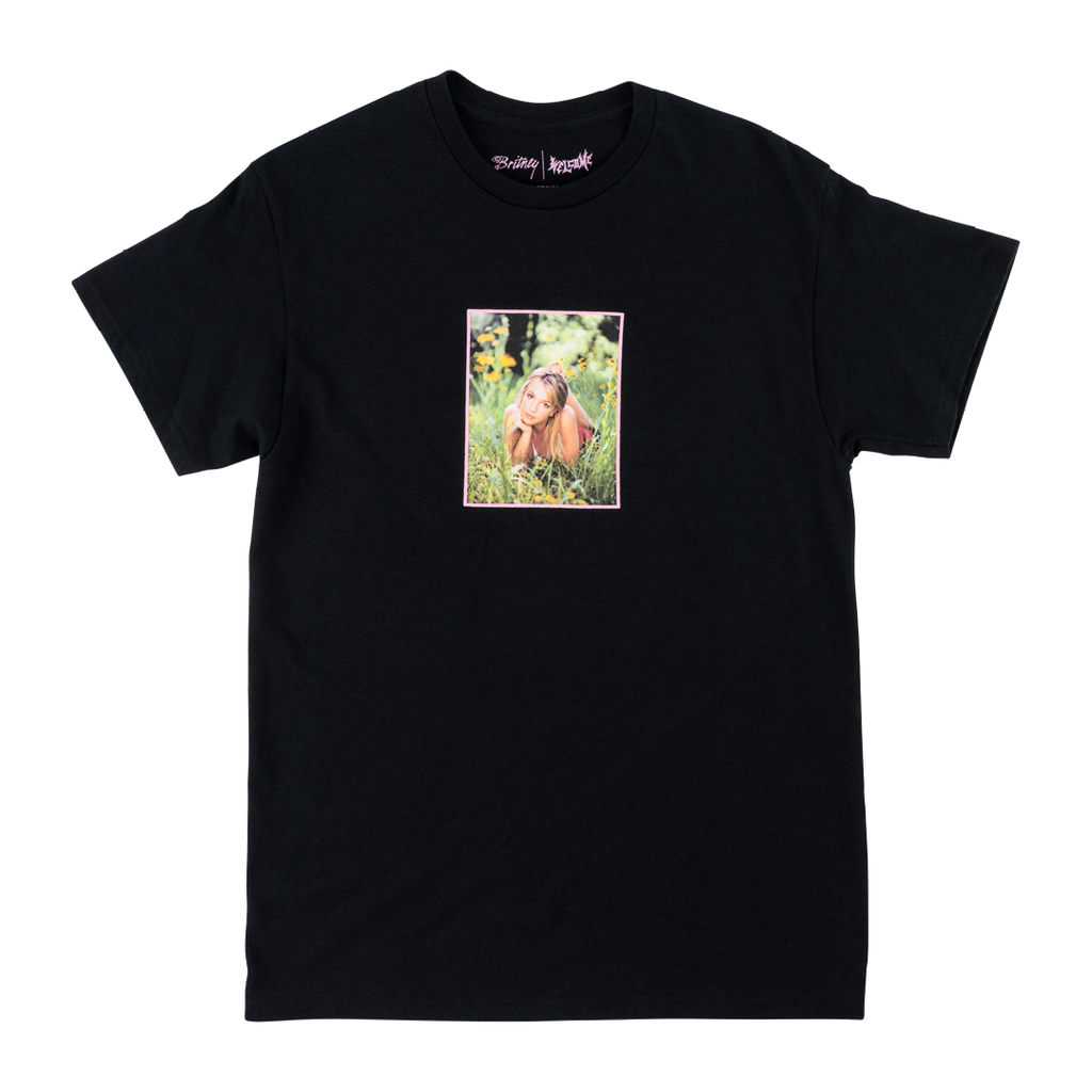 The WELCOME X BRITNEY DAISIES TEE BLACK by WELCOME features a centered rectangular graphic of a person crouching outdoors among grass and trees. This stylish black screen-printed tee is also known as the TILL THE WORLD ENDS TEE.