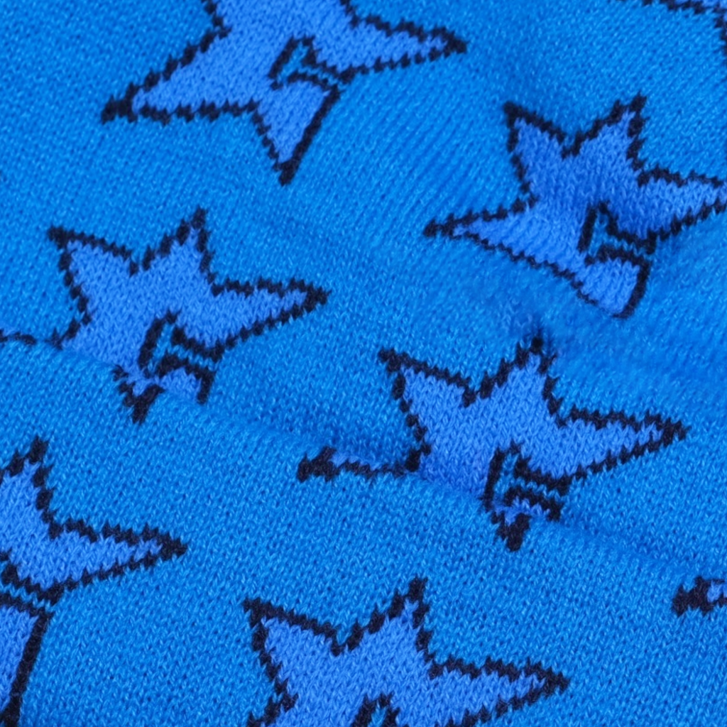 The CARPET CO. C-STAR BEANIE BLUE by Carpet Co. is crafted from 100% cotton fabric, adorned with black-outlined stars on a blue background, ideal for making reversible beanies.