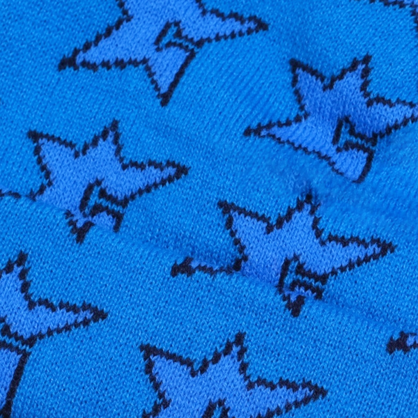 The CARPET CO. C-STAR BEANIE BLUE by Carpet Co. is crafted from 100% cotton fabric, adorned with black-outlined stars on a blue background, ideal for making reversible beanies.