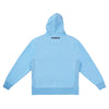 The back of a Carpet Bizarro Zip Hoodie Ice Blue with a logo on it.