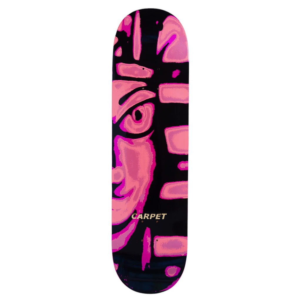 Skateboard deck titled "CARPET EGYPT PINK" by Carpet Co., featuring an abstract fusion of pink and black artwork, reminiscent of Egypt’s vibrant textiles, with "CARPET" boldly highlighted in yellow.