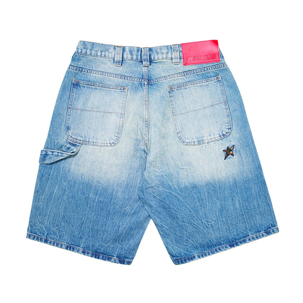 The CARPET CO. C STAR FADED DENIM SHORTS by Carpet Co. feature light blue faded denim, a loose fit, two large back pockets, a small side pocket, pink waistband label, and a star patch on the right side.