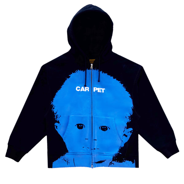 Carpet Co.'s black BabypHat double zip hoodie showcases a blue graphic of a child's face with the word "CARPET" across the chest.