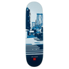 A skateboard deck with an image of a city and crosswalk, all in different shades of blue.