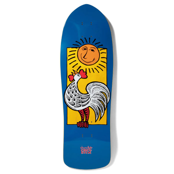 The CHOCOLATE X CHICO STIX NICARAGUAN SUNRISE RETRO SHAPE skateboard by CHOCOLATE showcases a lively design featuring a white rooster set against a yellow background with a smiling sun, capturing the essence of a Nicaraguan sunrise. The deck's retro shape is highlighted with a blue backdrop and text at the bottom.