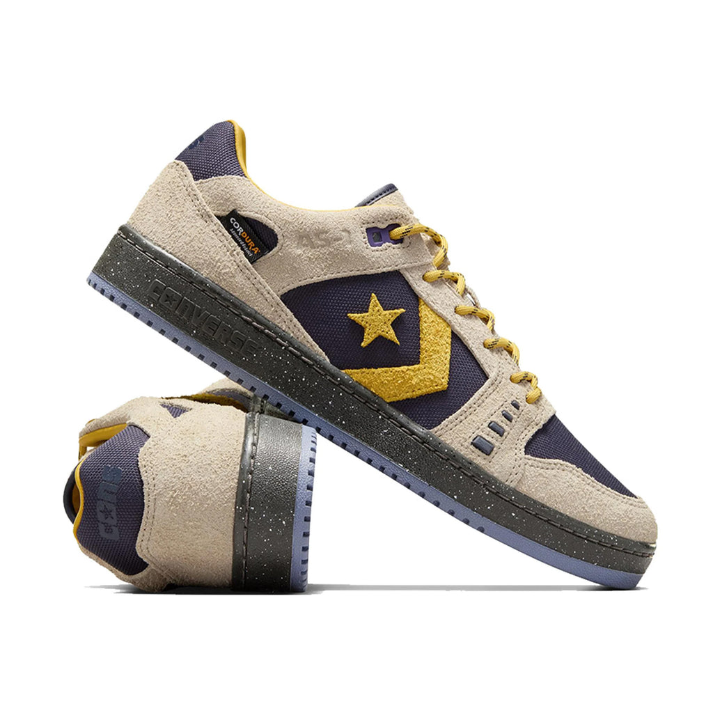 The CONVERSE CONS Alexis AS-1 Pro sneakers in Beach Stone and Baritone Blue showcase a design with yellow accents, a star logo, durable Cordura™ canvas construction, textured soles, and contrasting laces.