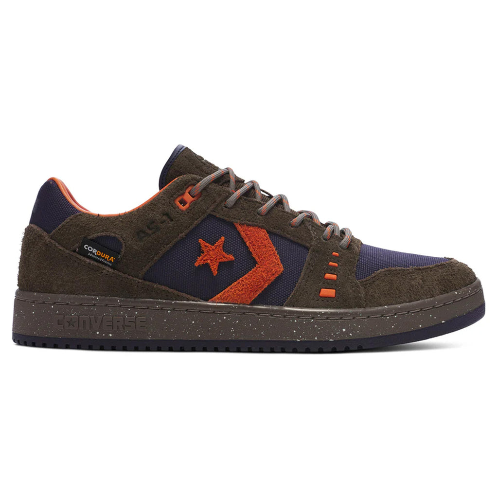 Introducing the CONVERSE CONS Alexis AS-1 Pro sneakers in Cordura™ Wren and Baritone Blue. These shoes boast a striking dark green and orange look, complemented by a star and chevron design. They're expertly crafted with durable Cordura™ fabric, accented with textured suede, and equipped with a herringbone outsole for enhanced traction.