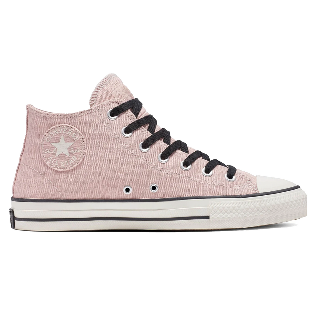 A light pink shoe with black laces and accents and a white sole.