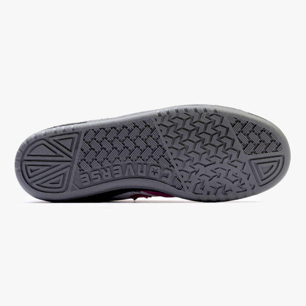 The sole of the CONVERSE CONS Fastbreak Pro Mid Cordura™ in Dark Matter/Barely Grey showcases a gray rubber tread pattern with zigzags and textured triangles, complemented by CX cushioning for increased comfort.