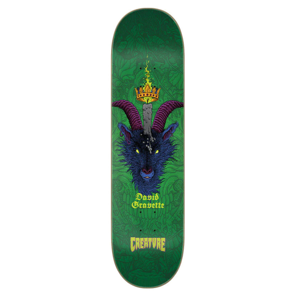 A green CREATURE skateboard with a picture of a demon on it.