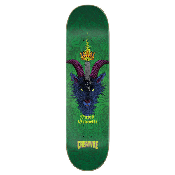 A green CREATURE skateboard with a picture of a demon on it.