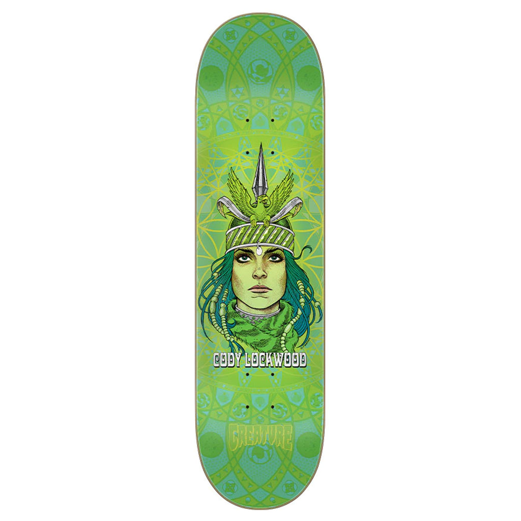 A green CREATURE skateboard with a picture of a woman wearing a headdress.