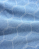 A close up of a blue and white fabric featuring Butter Goods Chain Link Denim Jeans Washed Indigo.