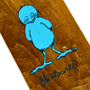 A close up of the blue colored bird cartoon printed on the top of a brown stained deck and Brenes' signaature.