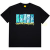 The Carpet Co. City Tee Black Glow in the Dark is a 100% cotton tee with five vertical blue and green graphic panels above yellow graffiti-style text on the front.