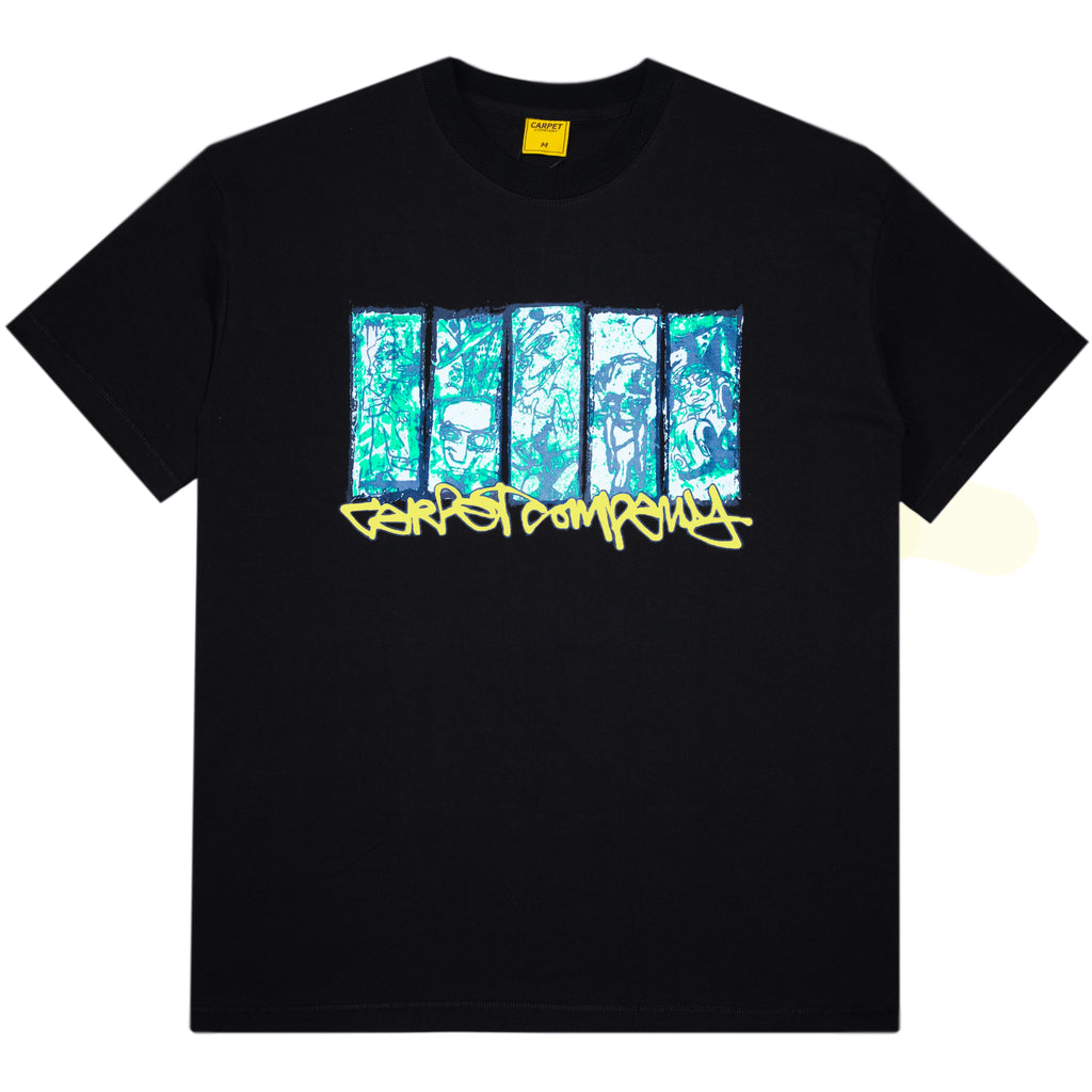 The Carpet Co. City Tee Black Glow in the Dark is a 100% cotton tee with five vertical blue and green graphic panels above yellow graffiti-style text on the front.