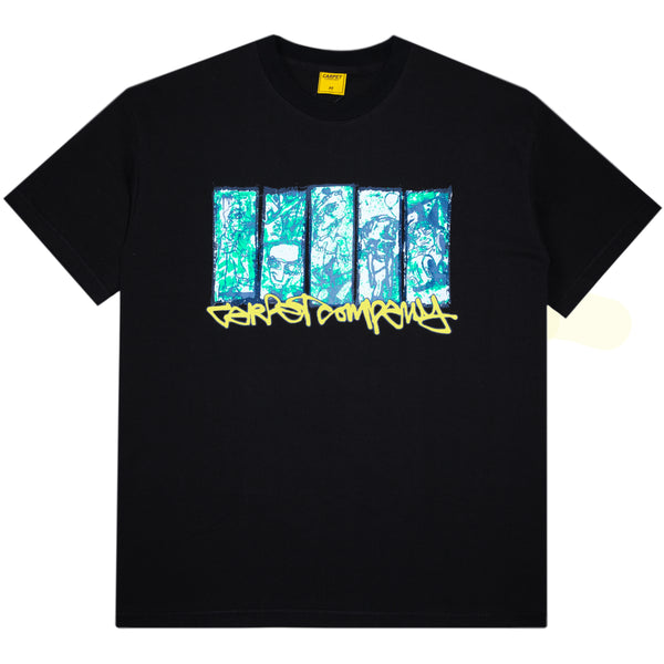 The Carpet Co. City Tee Black Glow in the Dark is a 100% cotton tee with five vertical blue and green graphic panels above yellow graffiti-style text on the front.