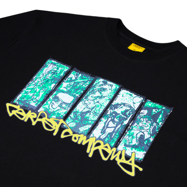 The CARPET CO. CITY TEE BLACK GLOW IN THE DARK by Carpet Co. features blue and green abstract rectangles with "carpet company" in yellow graffiti-style text printed below on the chest.