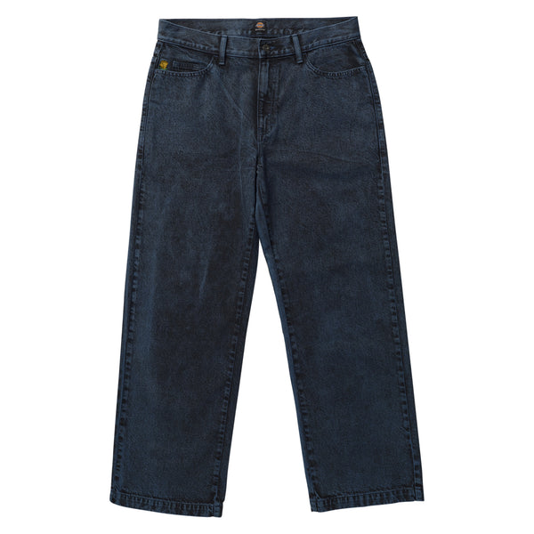 A pair of DICKIES TOM KNOX LOOSE DENIM JEANS DEEP BLUE jeans with yellow buttons.